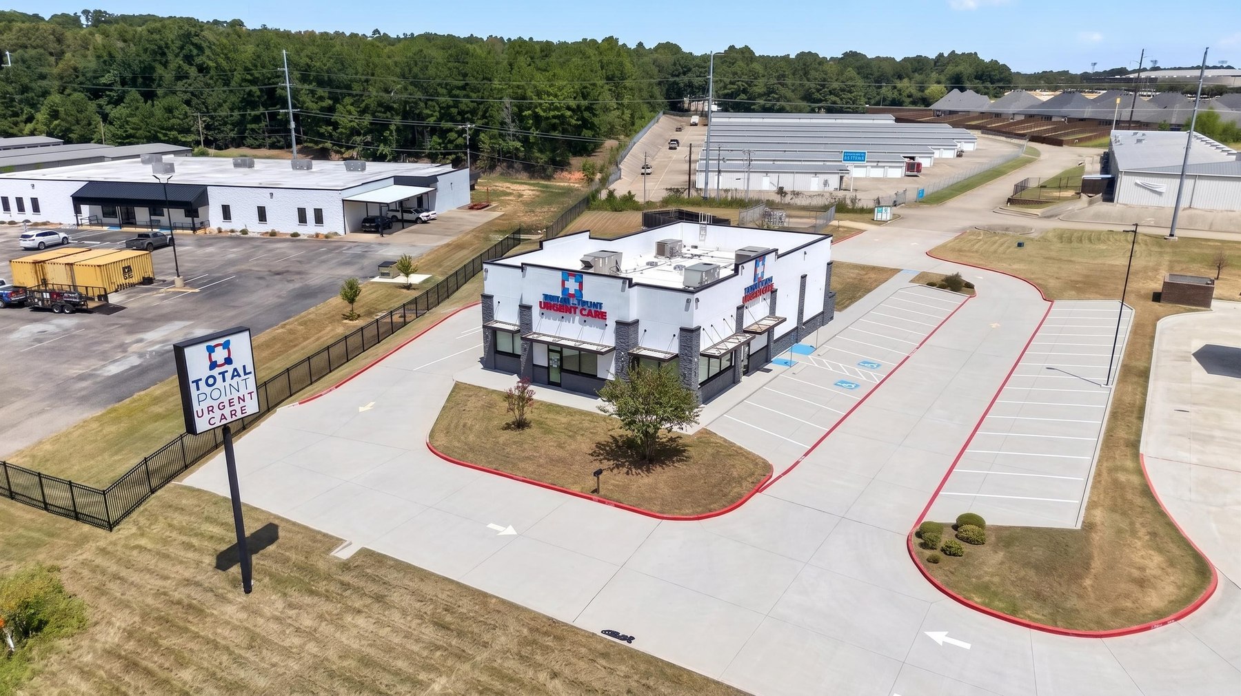 Aerial commercial property photography showing parking access and surrounding context