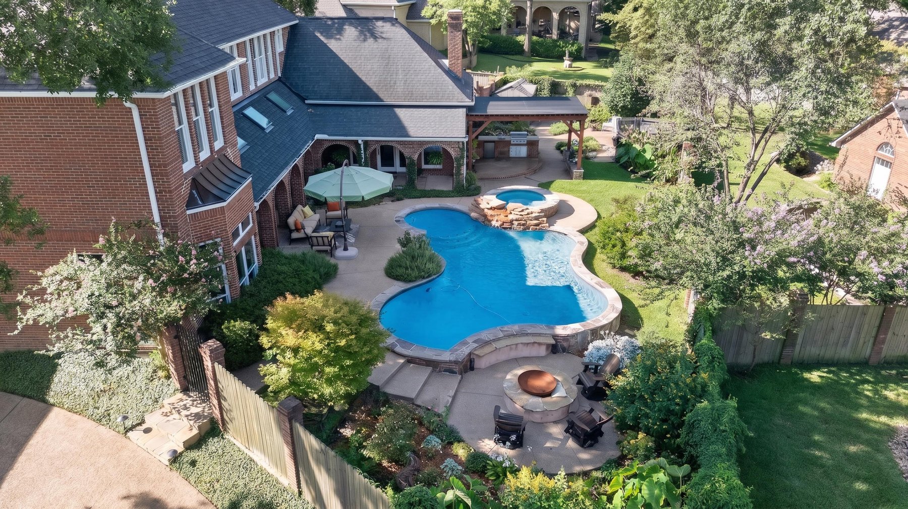 Drone photography showing a Hollytree Tyler Texas backyard pool and outdoor amenities