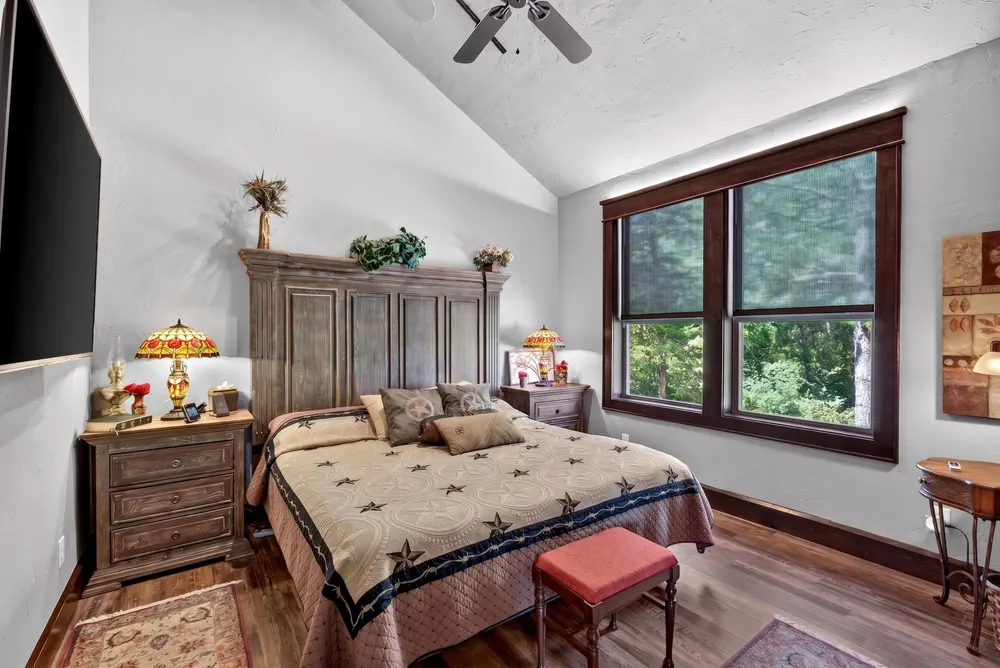 Primary bedroom with large window